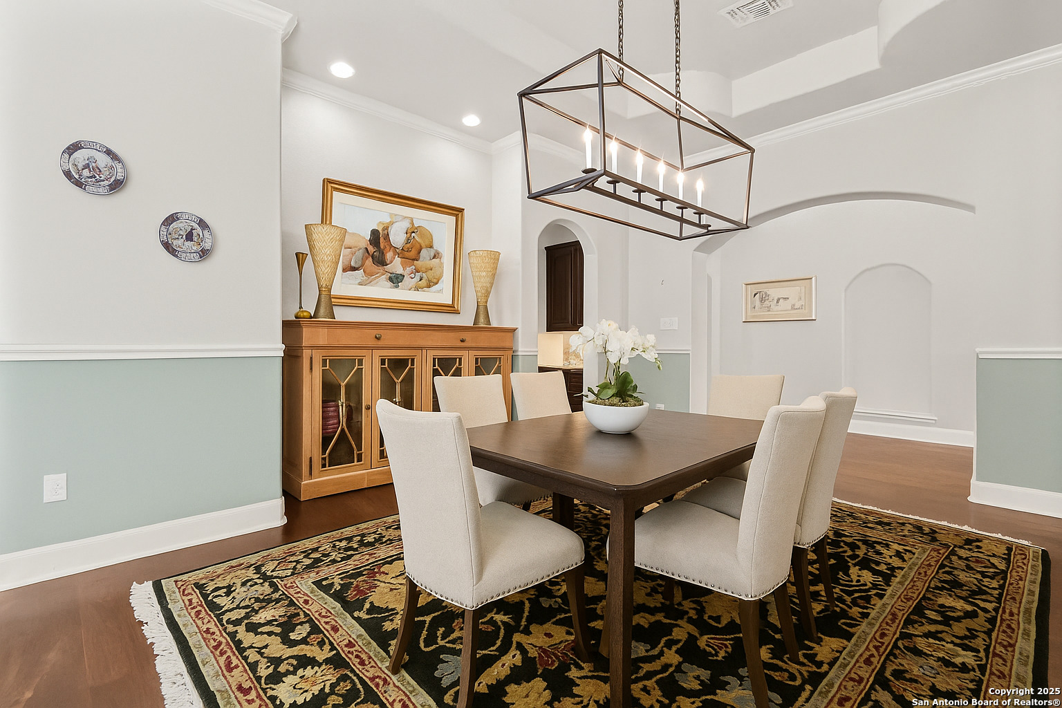 919 Sutters Rim San Antonio, TX 78258 - Photo 4 of 27 a view of a dining room with furniture wooden floor and a chandelier
