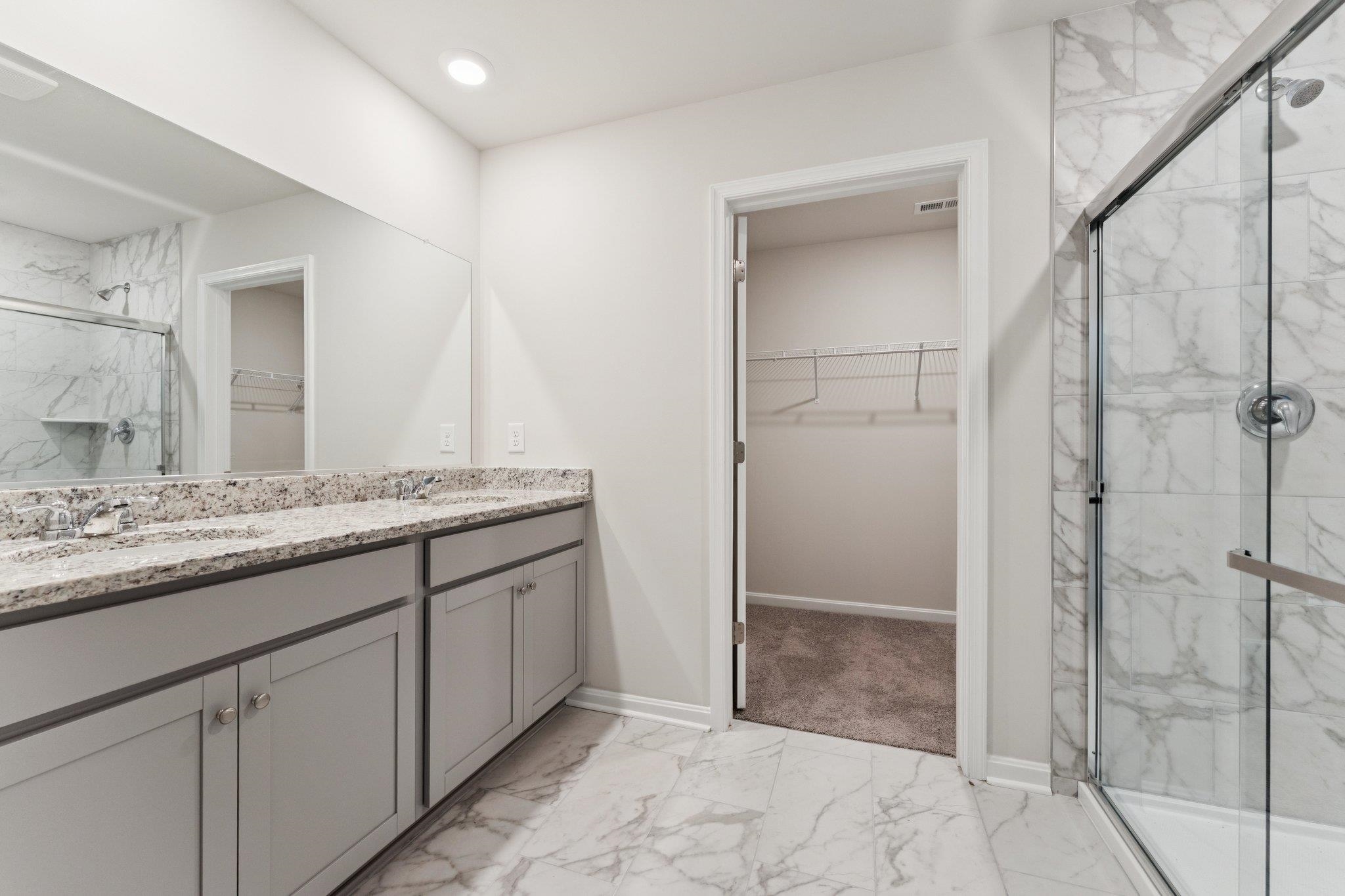 120 Meadow Ridge Way Staunton, VA 24401 - Photo 18 of 33 a bathroom with a granite countertop sink two mirror and shower