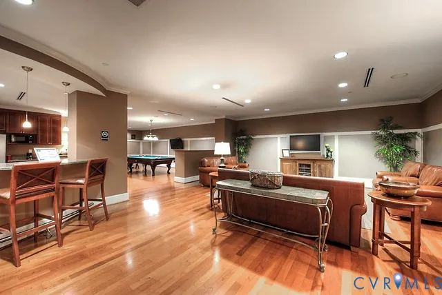 a living room with fireplace furniture and a flat screen tv