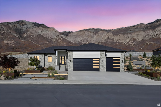 710 East Mountain Road North Ogden, UT 84414 - Photo 1 of 36 Enhanced photo (Landscape not included) Contemporary home with a garage, a mountain view, driveway, and stone siding