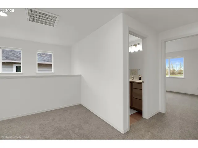 a bathroom with a granite countertop sink toilet a large mirror and shower