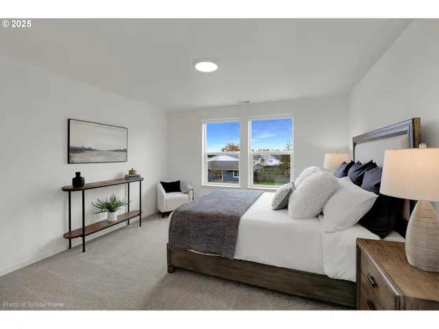 a view of kitchen with cabinets and refrigerator