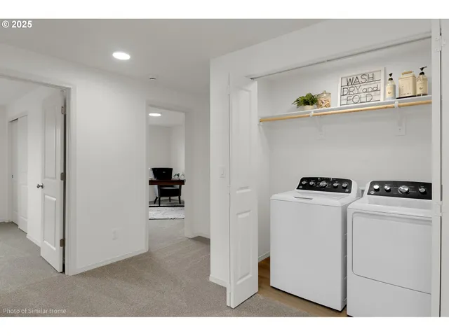 a view of kitchen cabinets with wooden floor