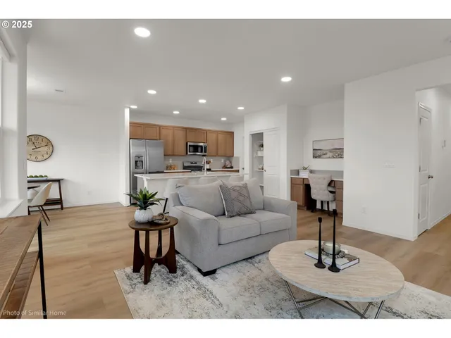 a living room with furniture and a table