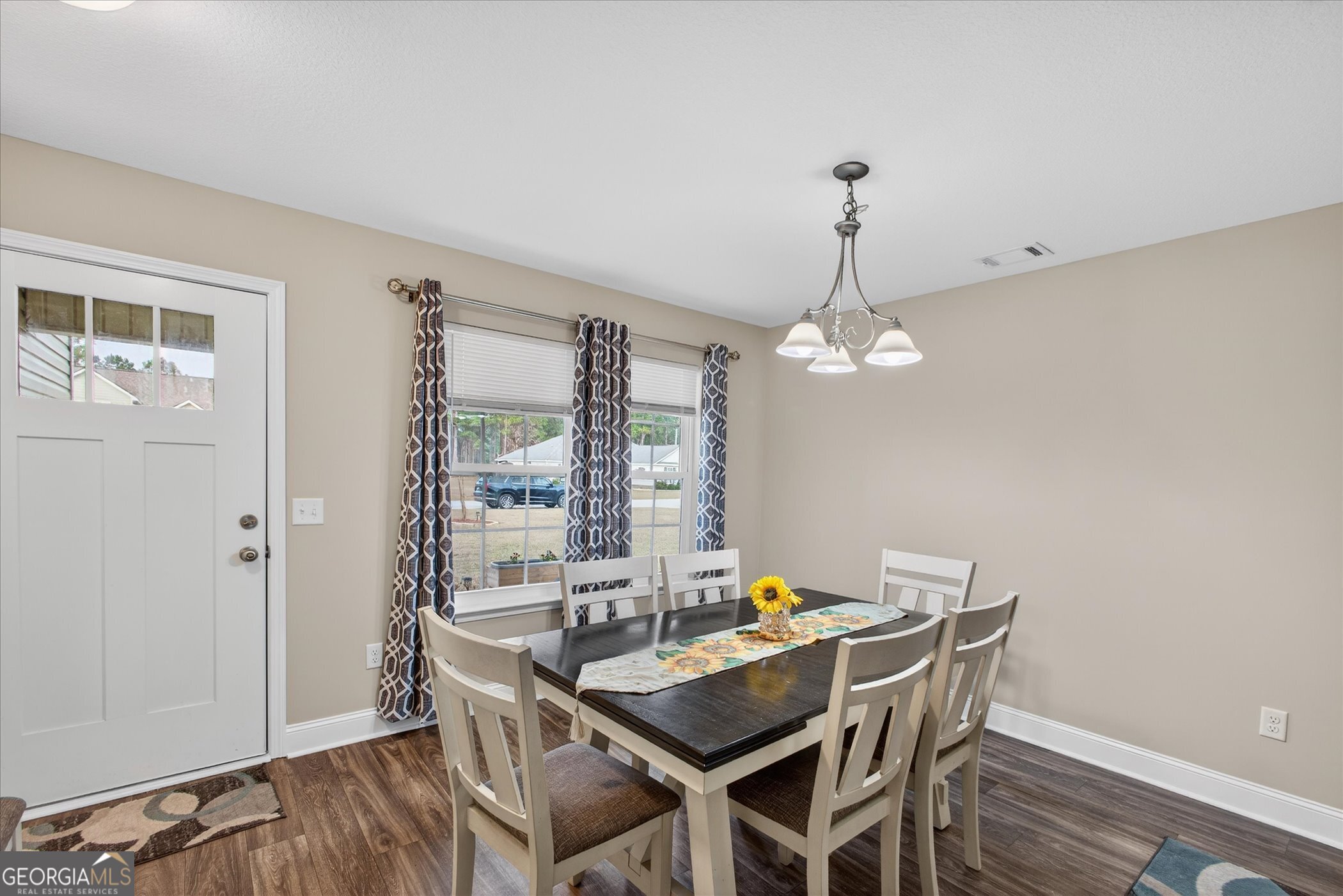 164 Stonebrook Way Statesboro, GA 30458 - Photo 12 of 46 a view of a dining room with furniture window and wooden floor