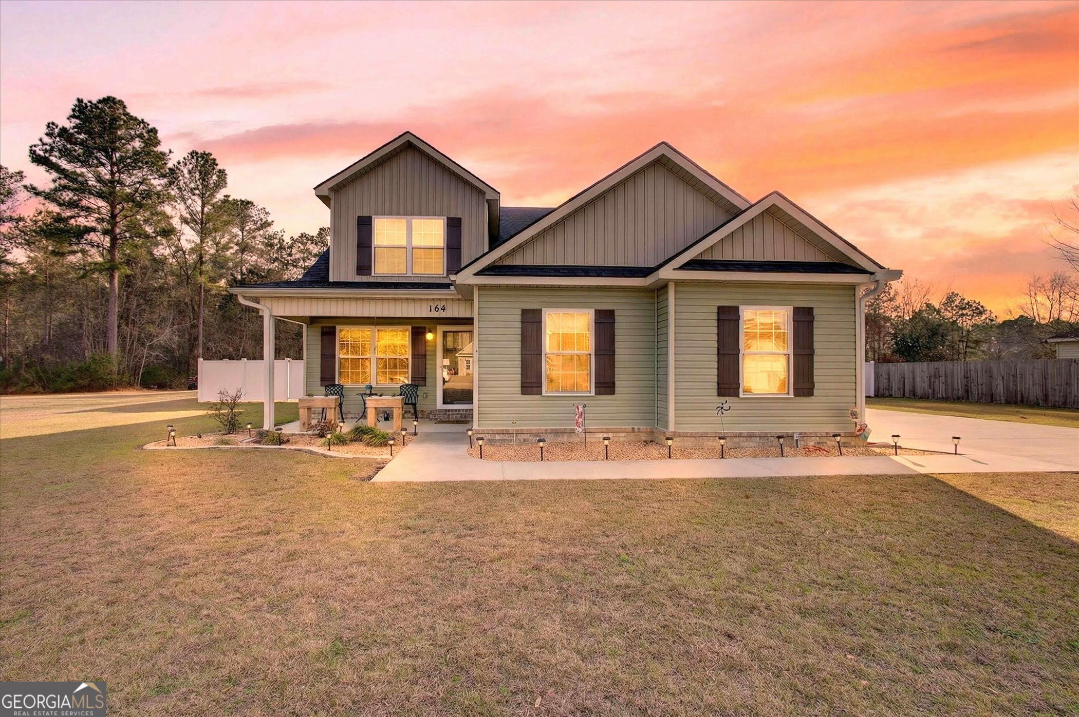 164 Stonebrook Way Statesboro, GA 30458 - Photo 2 of 46 a view of a house with swimming pool and sitting area