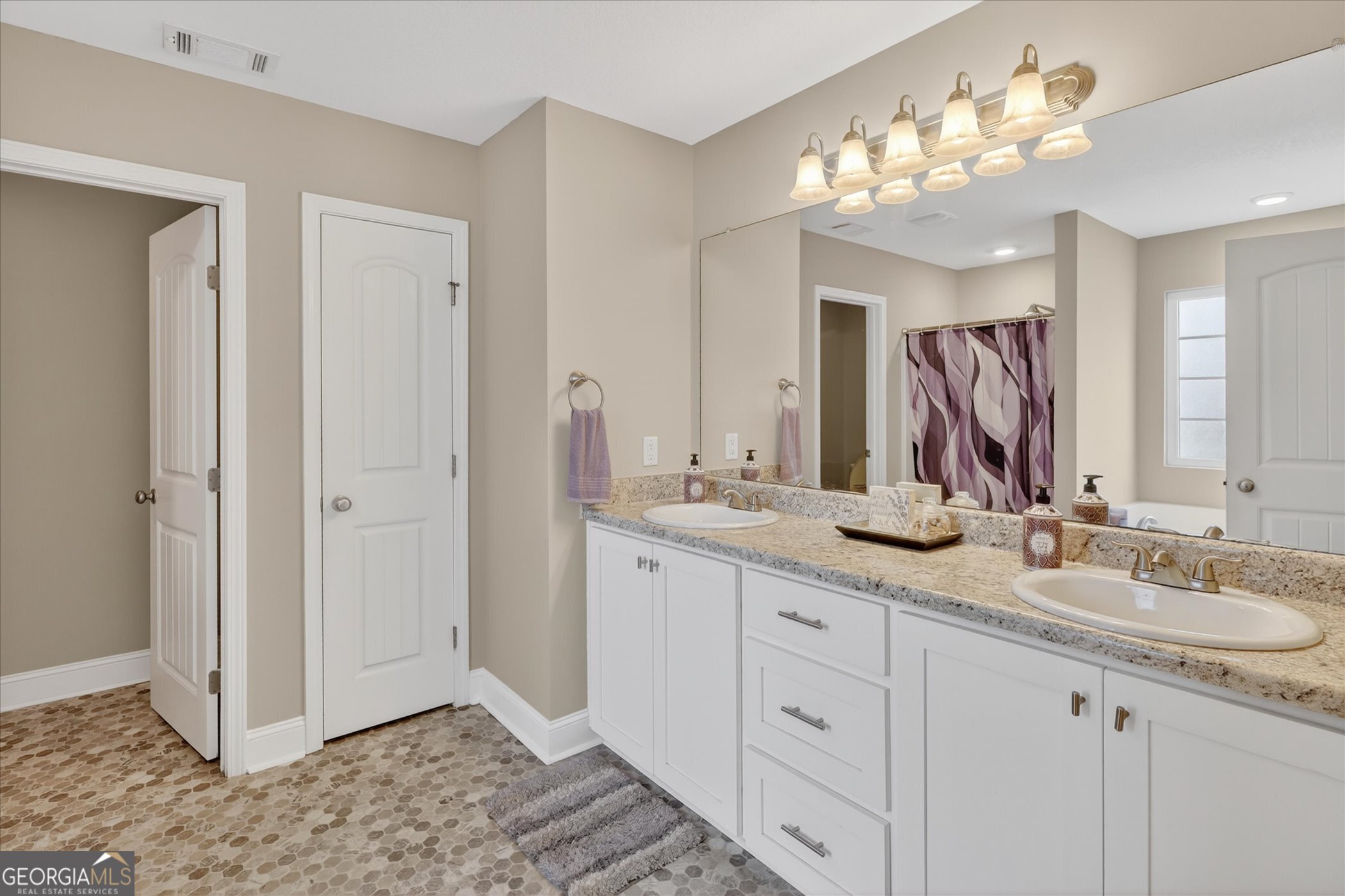 164 Stonebrook Way Statesboro, GA 30458 - Photo 22 of 46 a bathroom with a double vanity sink and a mirror
