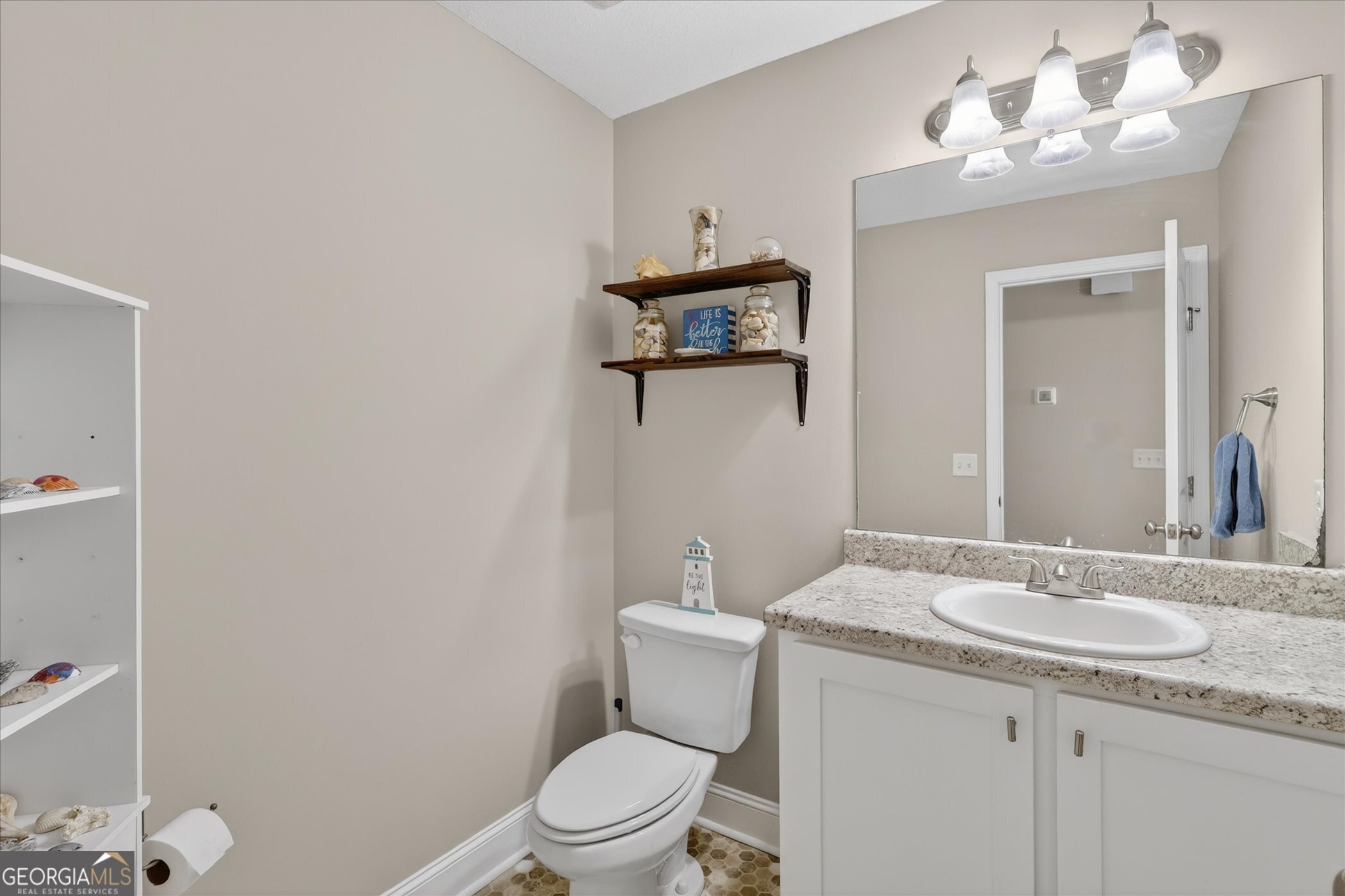164 Stonebrook Way Statesboro, GA 30458 - Photo 24 of 46 a bathroom with a granite countertop toilet sink and mirror