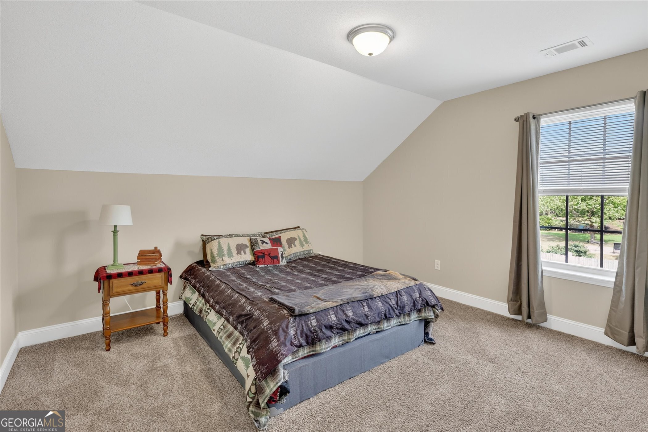 164 Stonebrook Way Statesboro, GA 30458 - Photo 25 of 46 a bedroom with a bed and a table