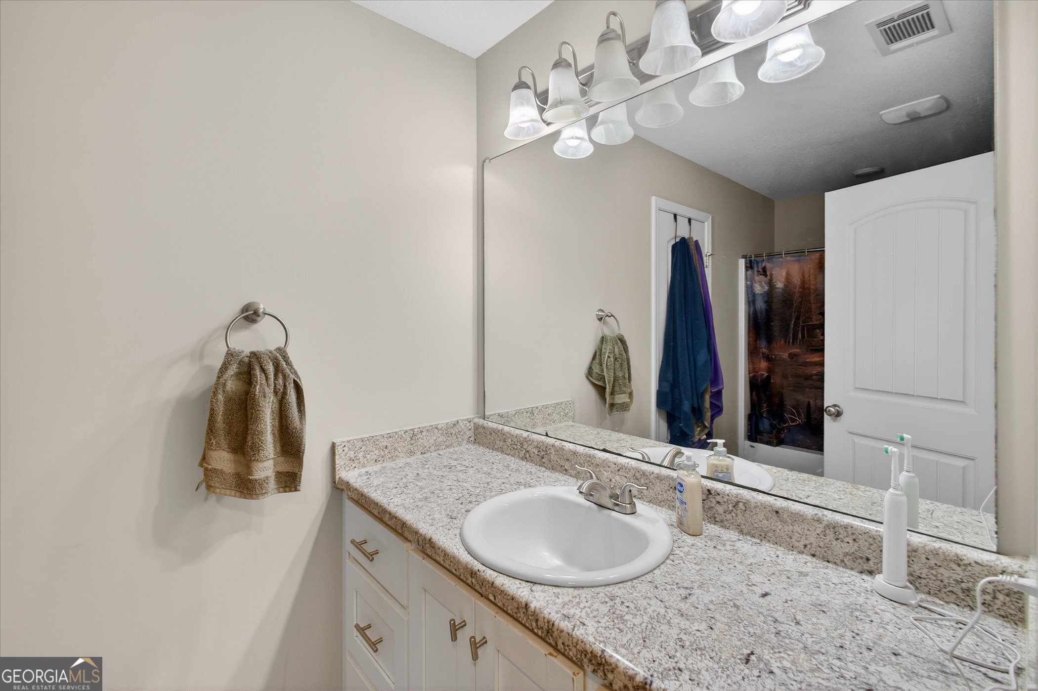 164 Stonebrook Way Statesboro, GA 30458 - Photo 29 of 46 a bathroom with a granite countertop sink and a mirror