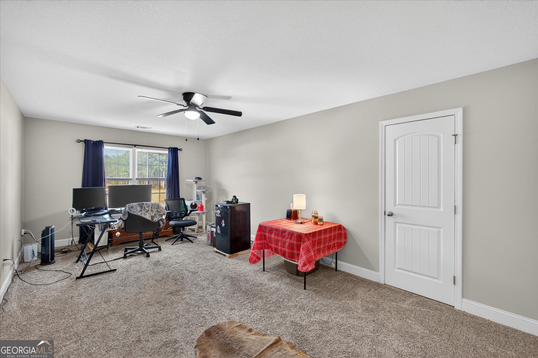 164 Stonebrook Way Statesboro, GA 30458 - Photo 32 of 46 a living room with furniture and a ceiling fan