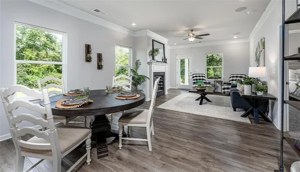 a view of a dining room with furniture window and wooden floor