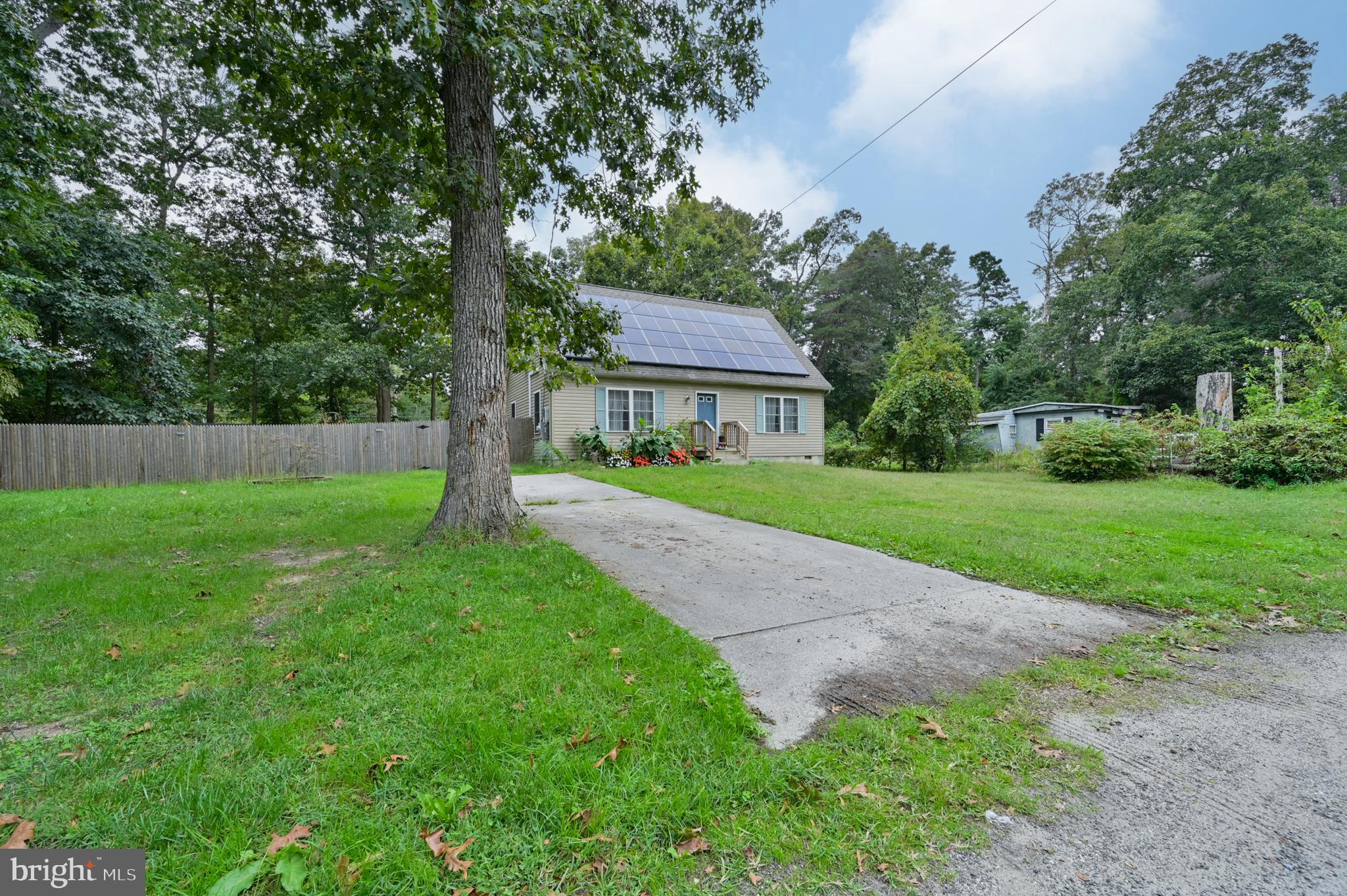 421 Evergreen Road Millville, NJ 08332 - Photo 16 of 26 a front view of a house with yard and green space