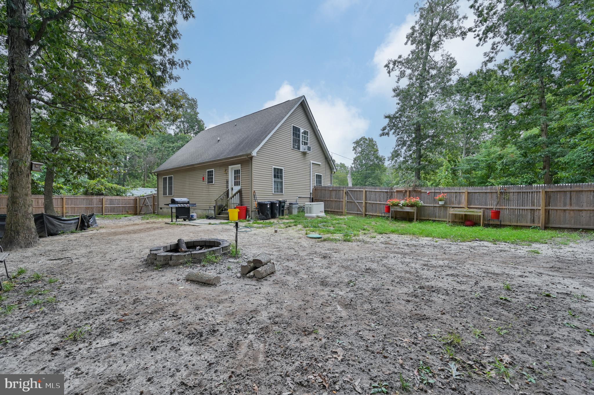 421 Evergreen Road Millville, NJ 08332 - Photo 24 of 26 a view of a house with a yard and large trees
