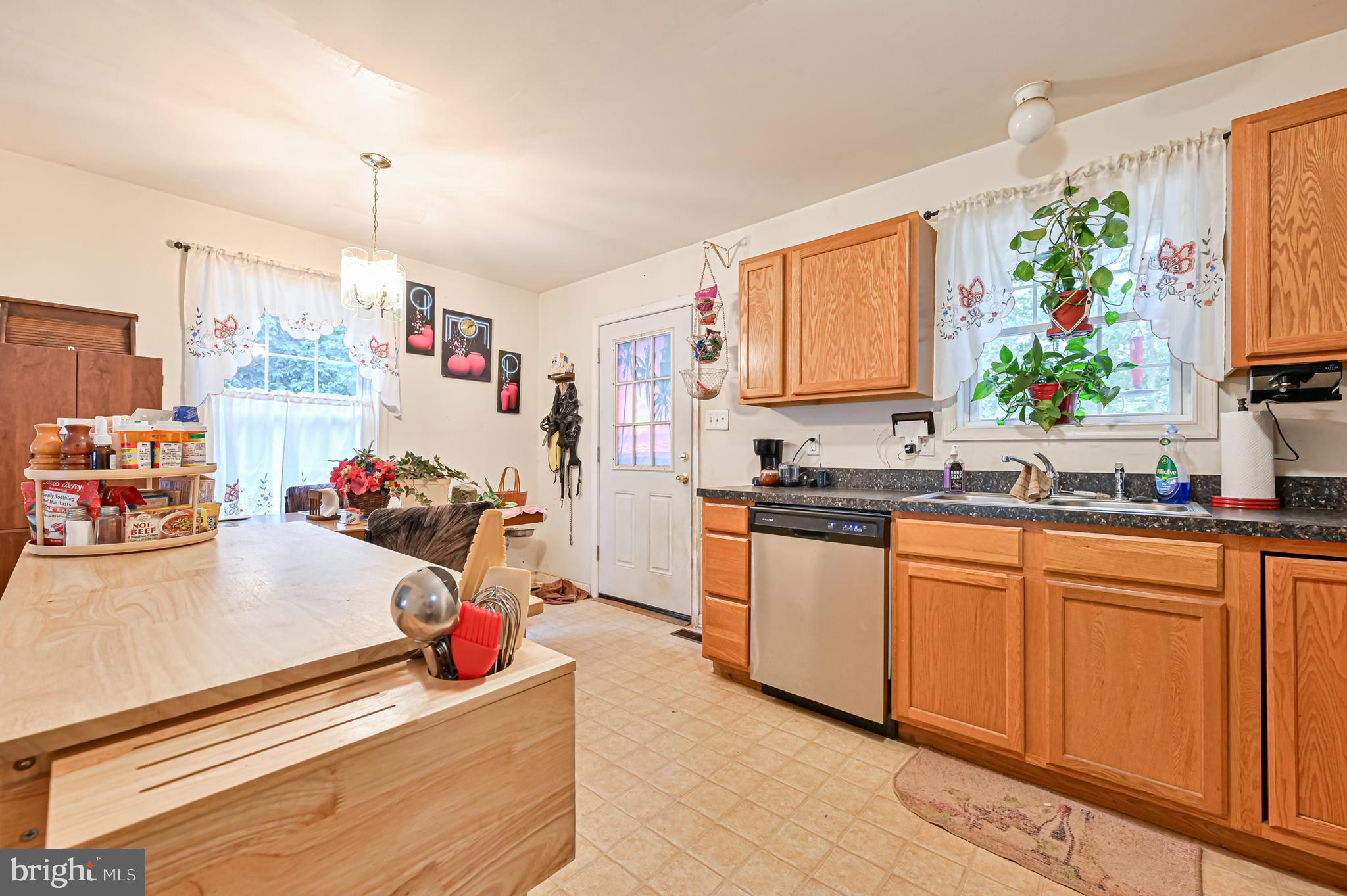 421 Evergreen Road Millville, NJ 08332 - Photo 3 of 26 a kitchen filled with white cabinets and sink