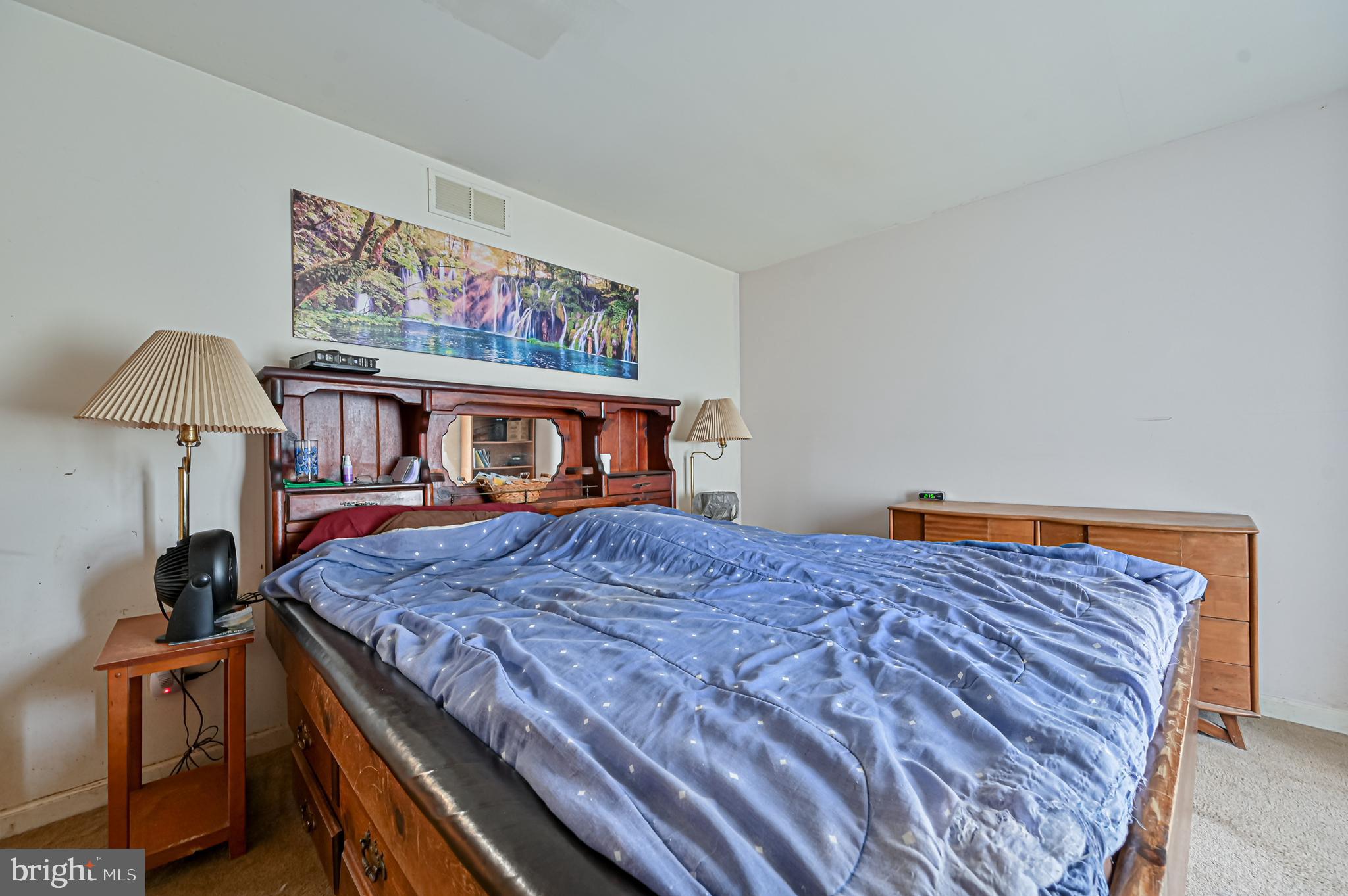 421 Evergreen Road Millville, NJ 08332 - Photo 9 of 26 a bedroom with a bed and a dresser