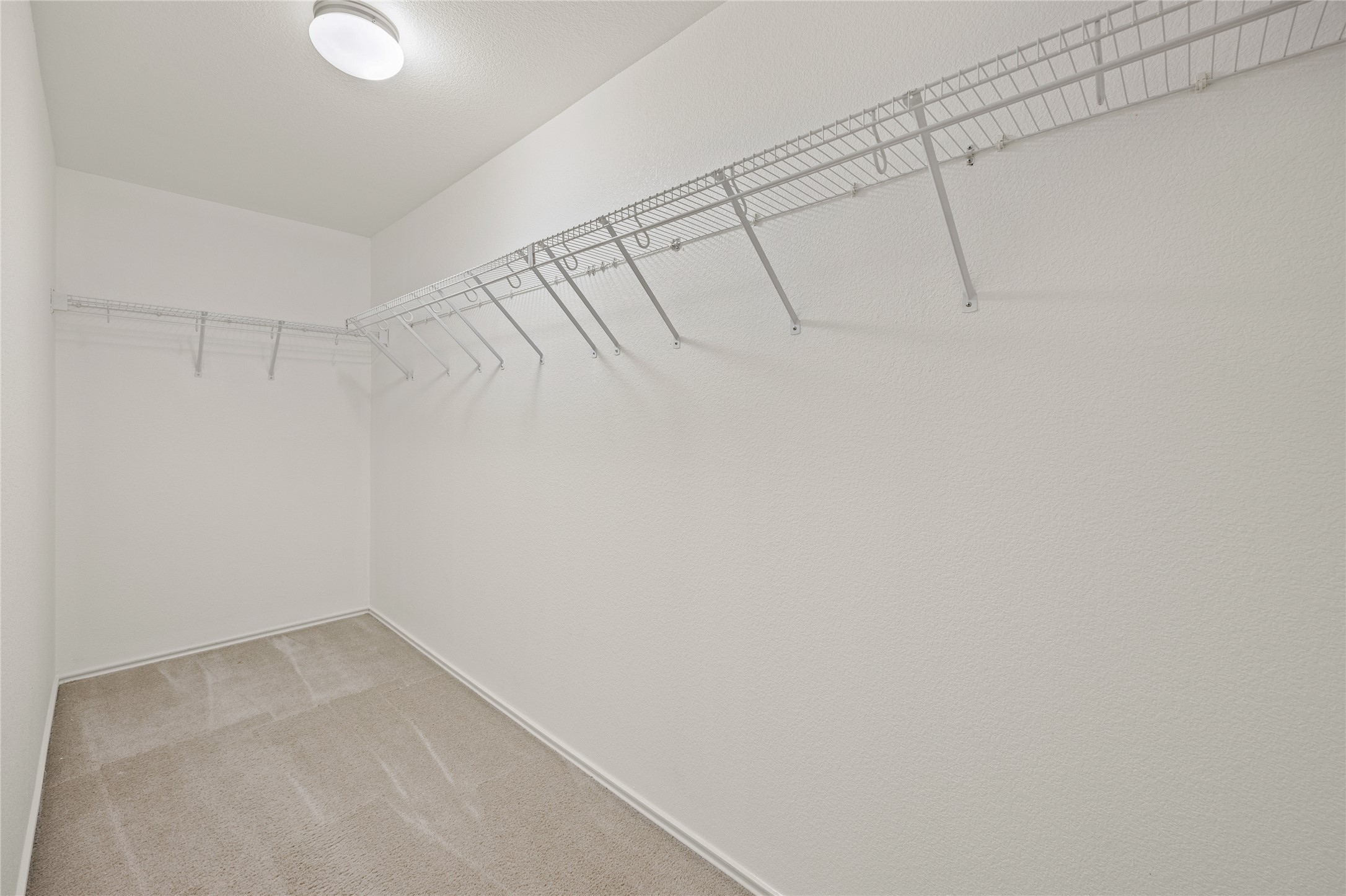 198 Black Forest Road Buda, TX 78610 - Photo 18 of 23 An organized closet featuring wire shelving for optimal storage, keeping belongings tidy.
