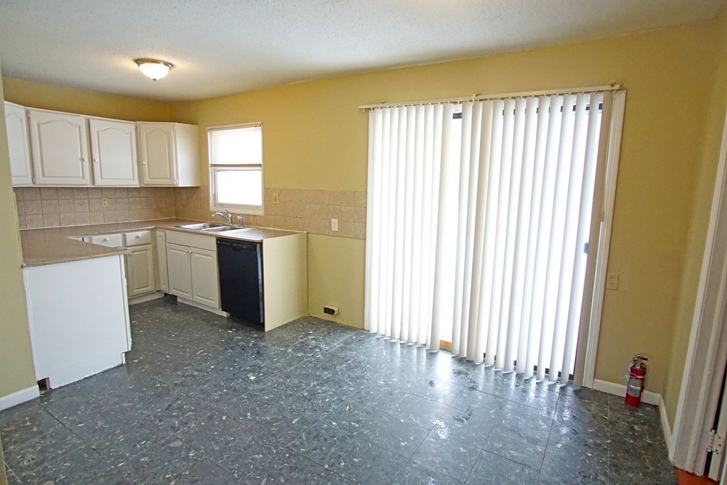 40 Old Farm Road Springfield, MA 01119 - Photo 4 of 16 a view of a kitchen with wooden floor and electronic appliances