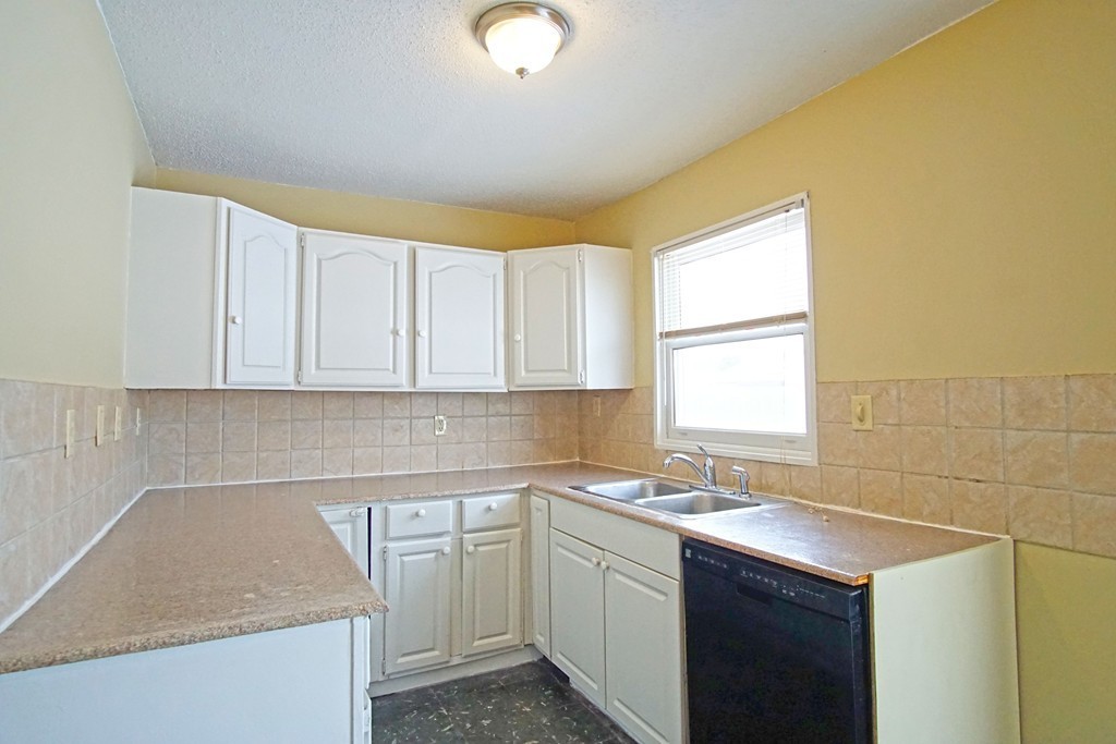40 Old Farm Road Springfield, MA 01119 - Photo 6 of 16 a kitchen with a sink cabinets and window