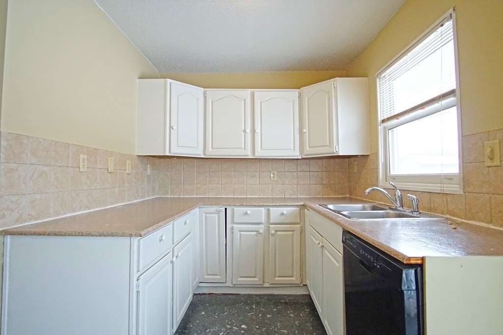 40 Old Farm Road Springfield, MA 01119 - Photo 7 of 16 a kitchen with a sink cabinets and window