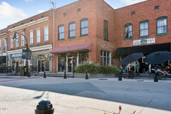 a view of a street with sitting area