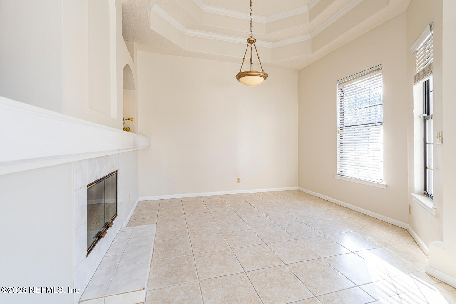 1467 Tama-Ran Place Fruit Cove, FL 32259 - Photo 13 of 22 an empty room with windows and fireplace