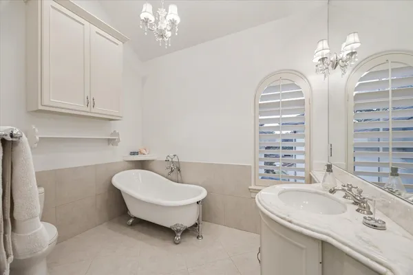 a spacious bedroom with a bed and a window