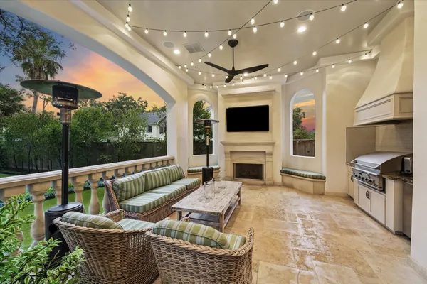 a view of a swimming pool with a yard and plants