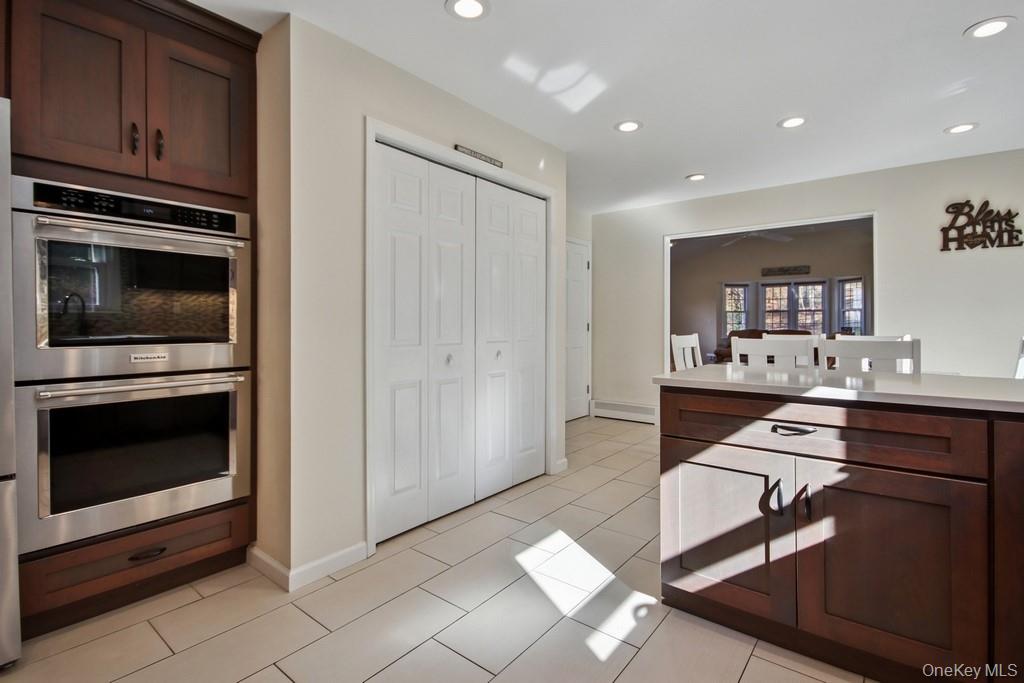 7 Farview Road Hopewell Junction, NY 12533 - Photo 12 of 32 a kitchen with granite countertop a stove and cabinets