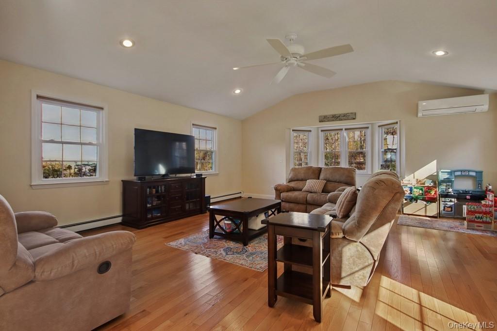 7 Farview Road Hopewell Junction, NY 12533 - Photo 16 of 32 a living room with furniture and a flat screen tv