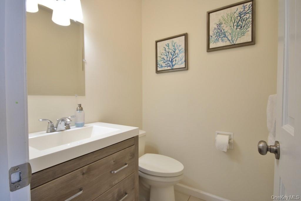 7 Farview Road Hopewell Junction, NY 12533 - Photo 19 of 32 a bathroom with a sink mirror and toilet