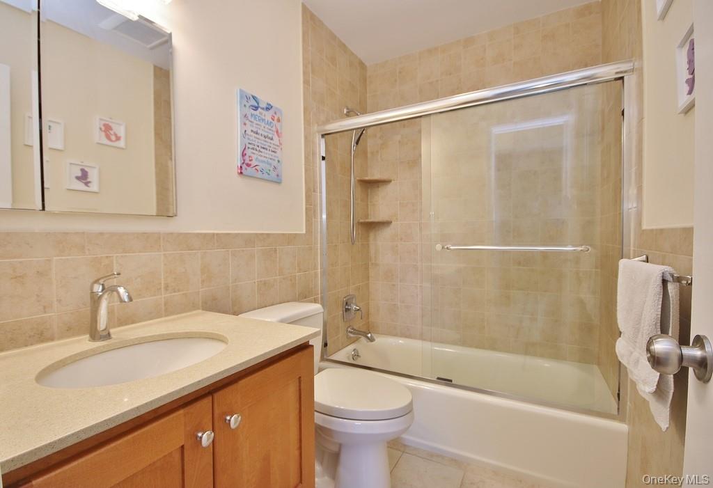 7 Farview Road Hopewell Junction, NY 12533 - Photo 21 of 32 a bathroom with a sink a toilet and shower