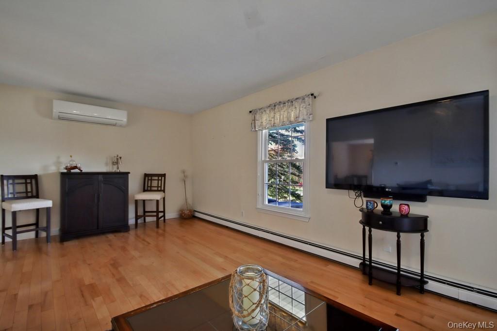 7 Farview Road Hopewell Junction, NY 12533 - Photo 10 of 32 a living room with furniture and a flat screen tv
