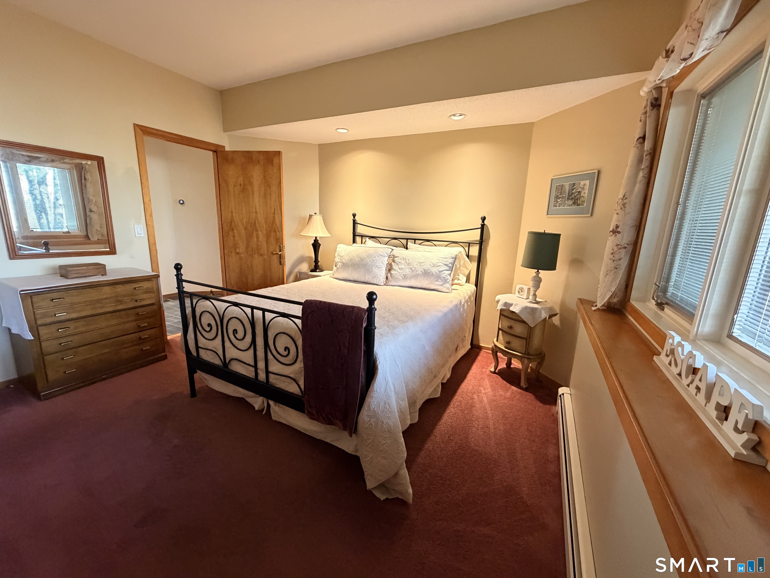 86 Washburn Road Canton, CT 06019 - Photo 12 of 40 a bed room with a bed furniture and a flat tv screen