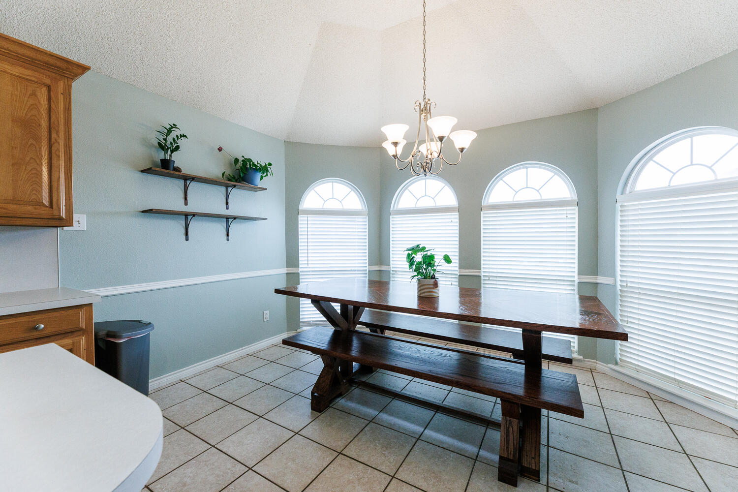 5504 101st Street Lubbock, TX 79424 - Photo 15 of 50 a view of a livingroom with furniture and a chandelier