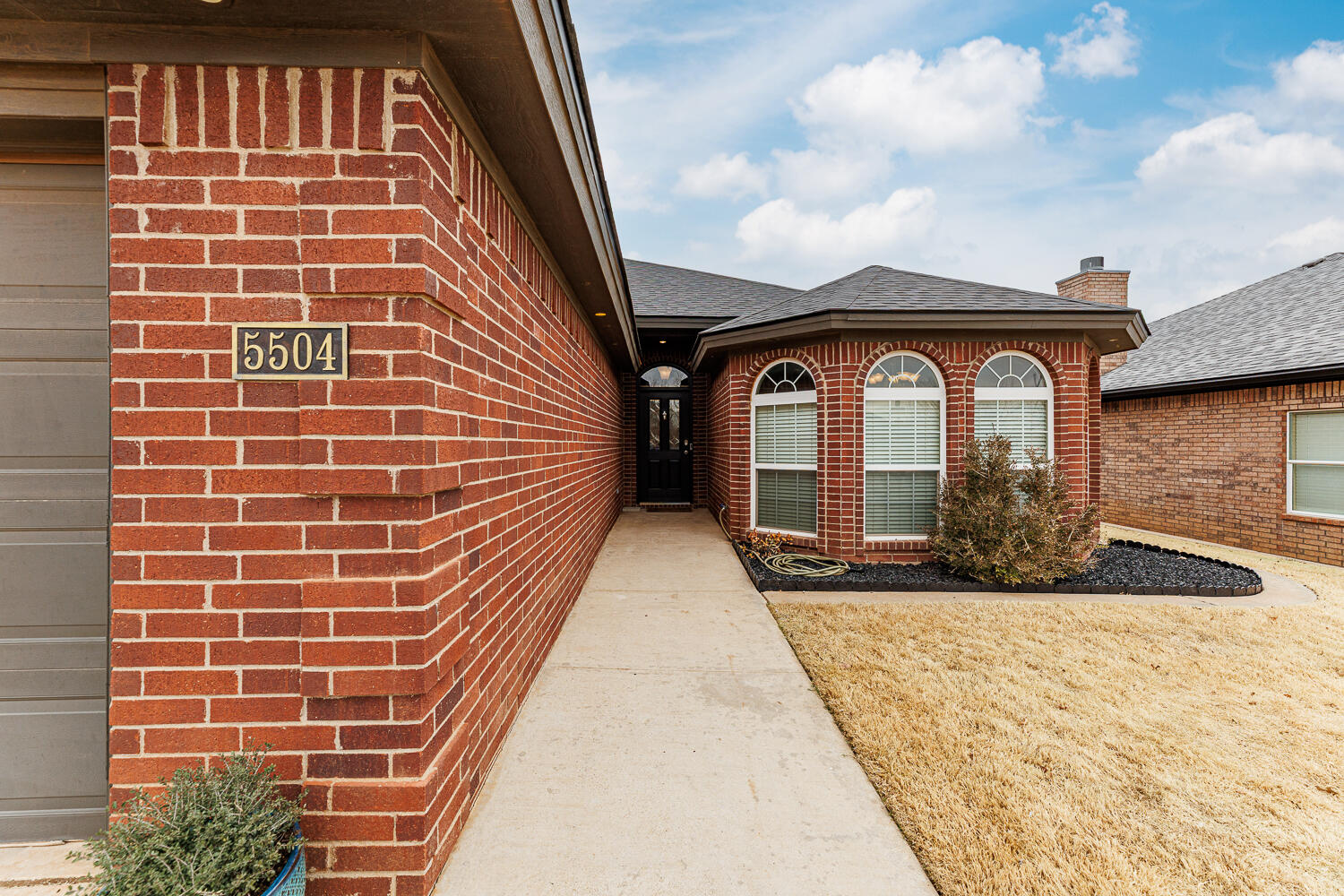5504 101st Street Lubbock, TX 79424 - Photo 2 of 50 a front view of a house
