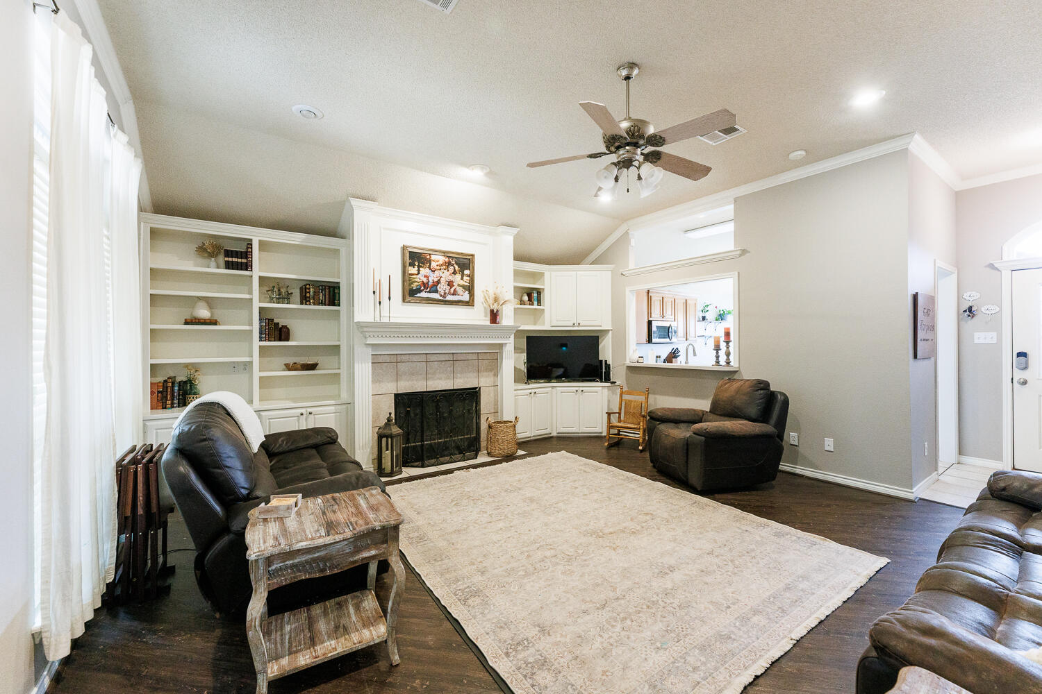 5504 101st Street Lubbock, TX 79424 - Photo 21 of 50 a living room with furniture and a fireplace