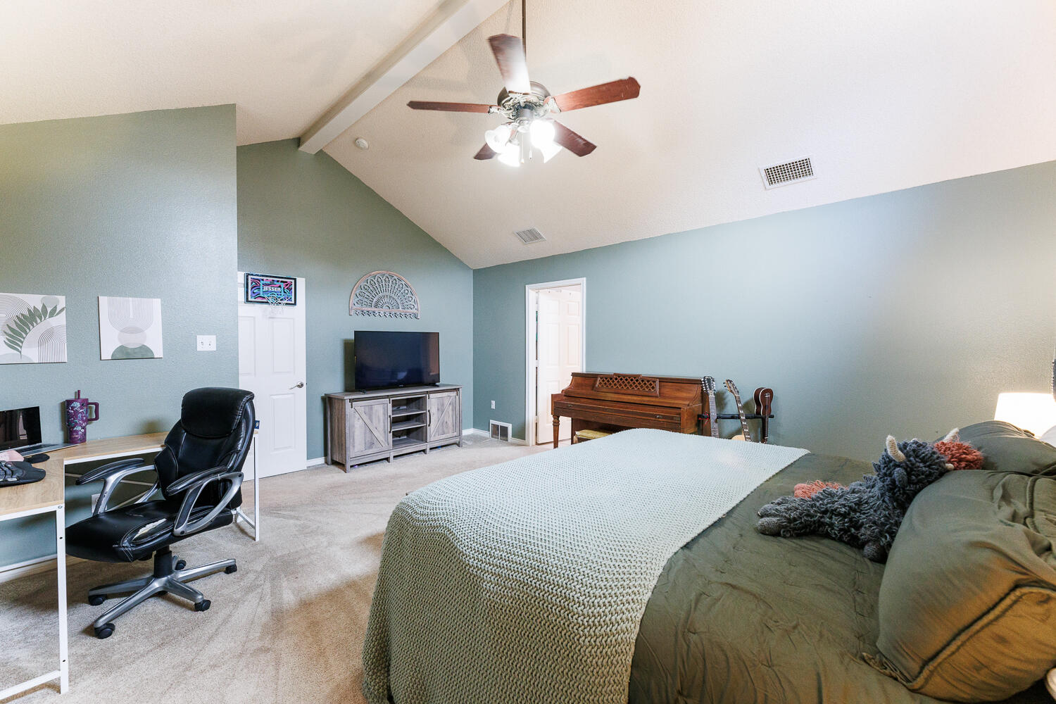 5504 101st Street Lubbock, TX 79424 - Photo 23 of 50 a bed room with bed and a flat screen tv