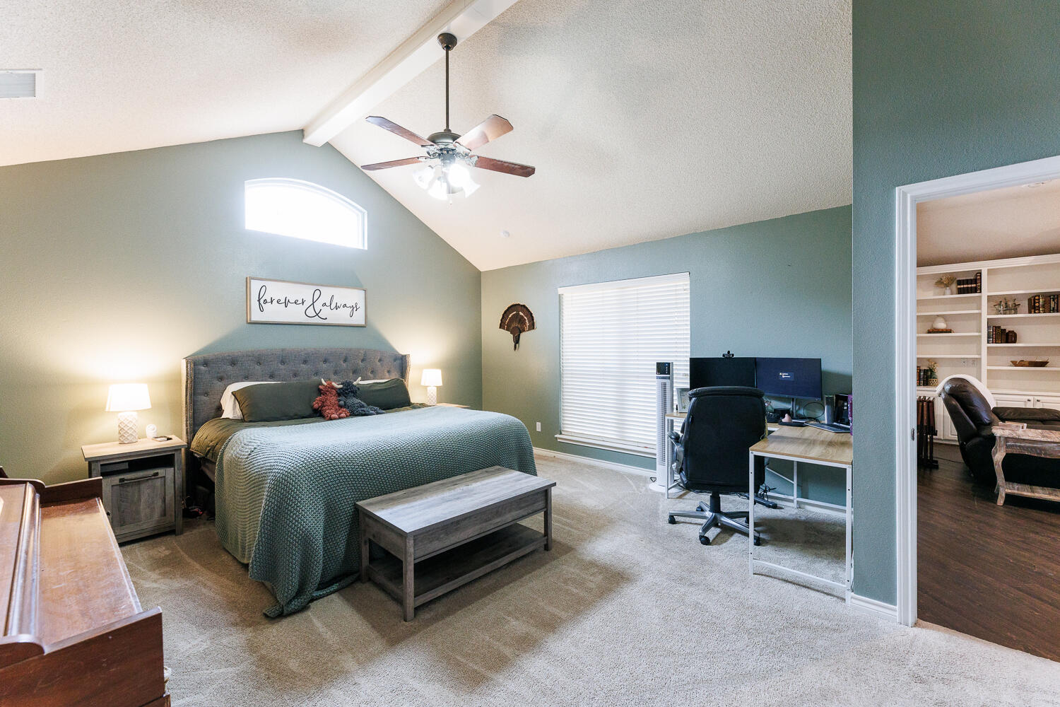 5504 101st Street Lubbock, TX 79424 - Photo 24 of 50 a bedroom with a bed and a chandelier