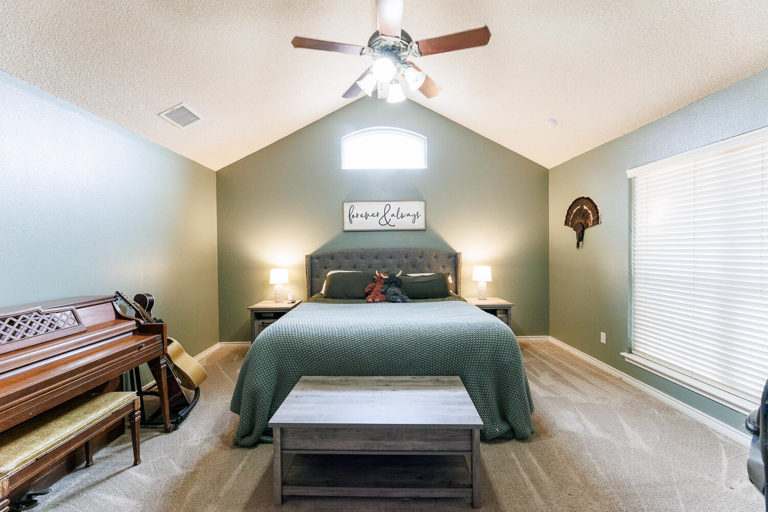 5504 101st Street Lubbock, TX 79424 - Photo 25 of 50 a bedroom with a bed and a chandelier