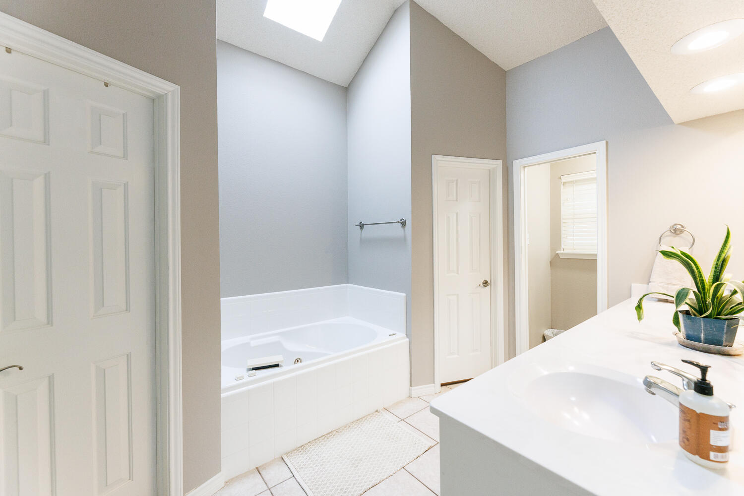 5504 101st Street Lubbock, TX 79424 - Photo 28 of 50 a bathroom with a tub and sink