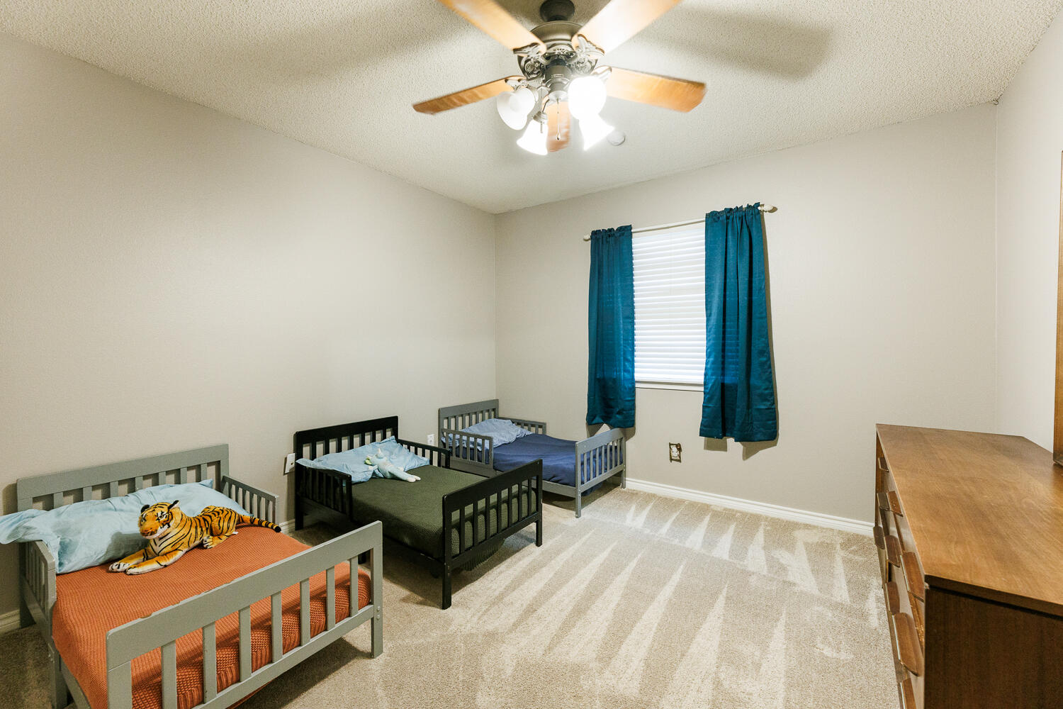 5504 101st Street Lubbock, TX 79424 - Photo 35 of 50 a bedroom with furniture and a large window