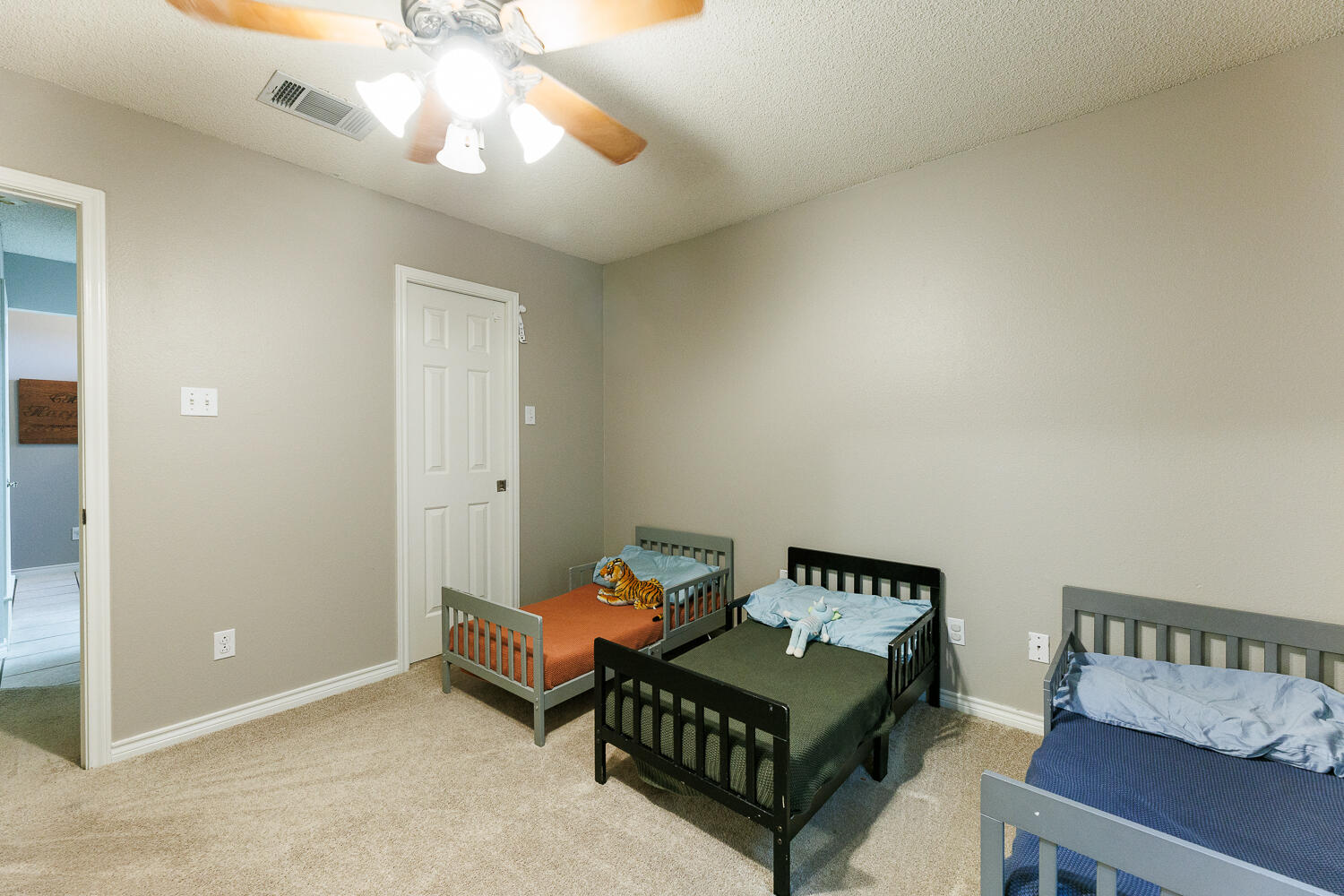 5504 101st Street Lubbock, TX 79424 - Photo 36 of 50 a room with furniture and a chandelier fan