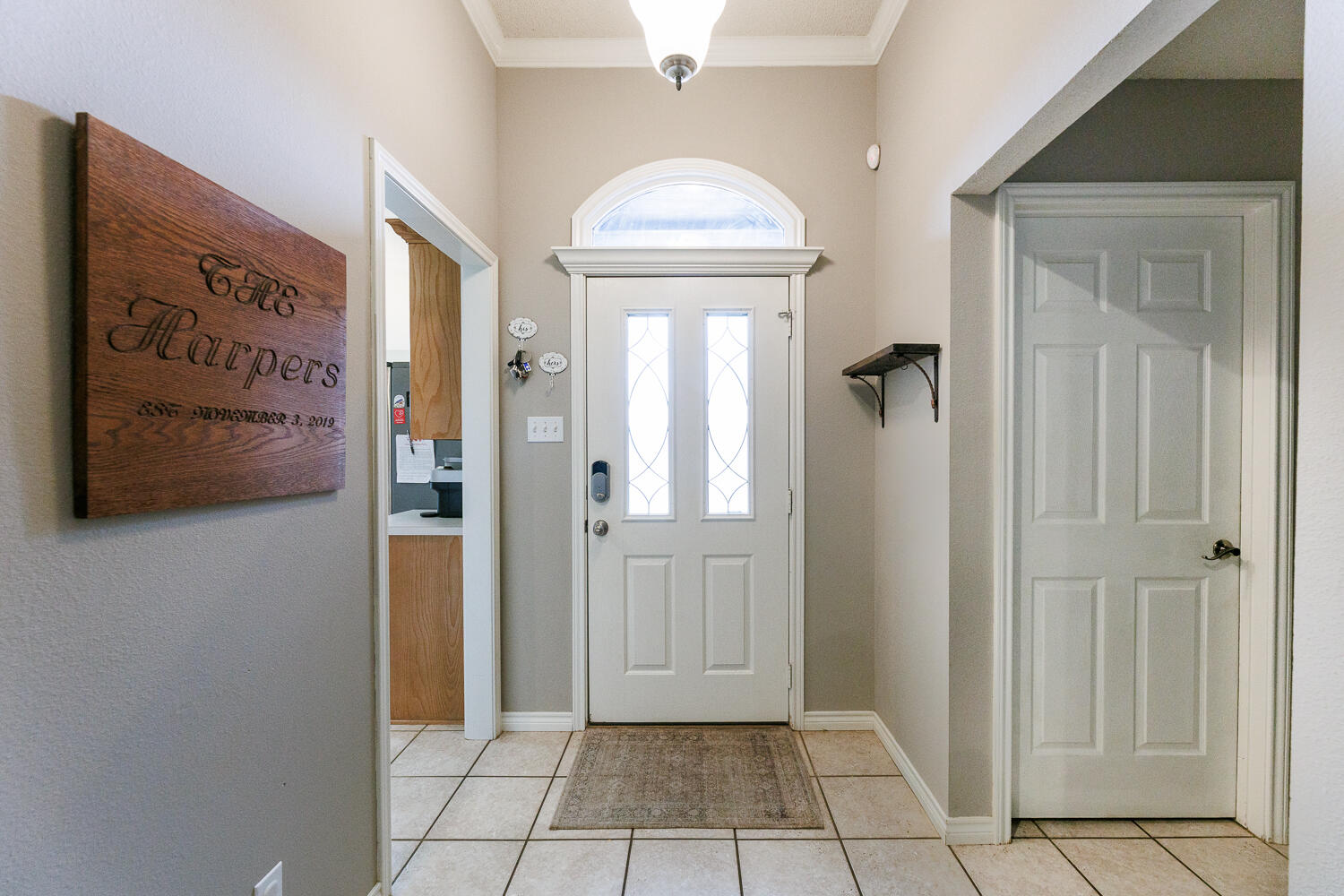 5504 101st Street Lubbock, TX 79424 - Photo 4 of 50 a view of a hallway with entryway and front door