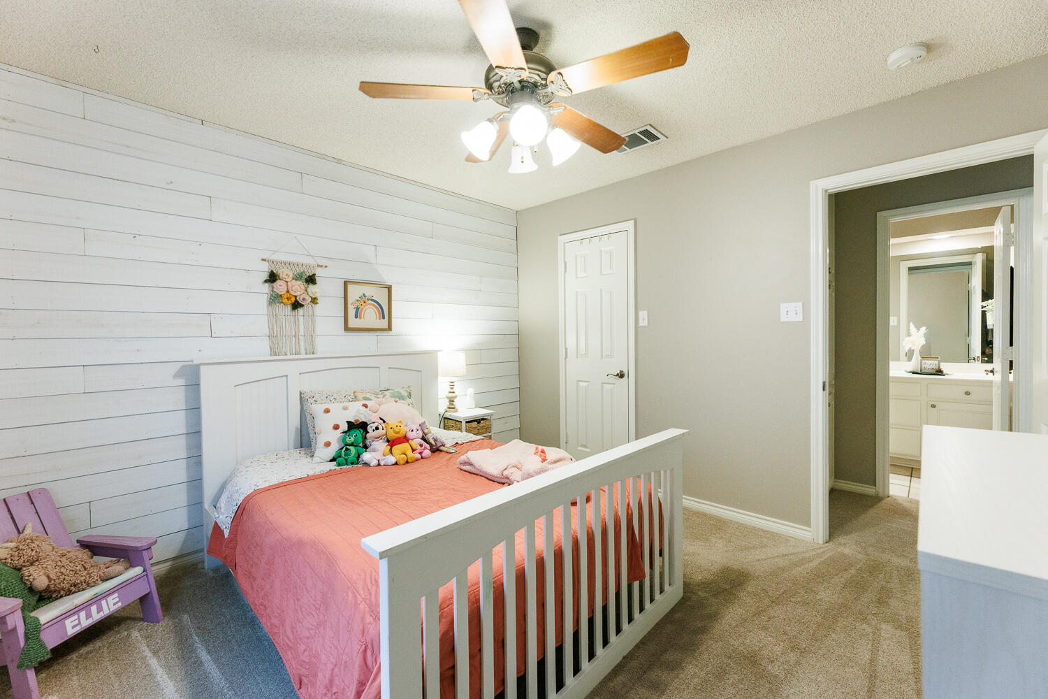5504 101st Street Lubbock, TX 79424 - Photo 41 of 50 a bedroom with a bed and a chandelier
