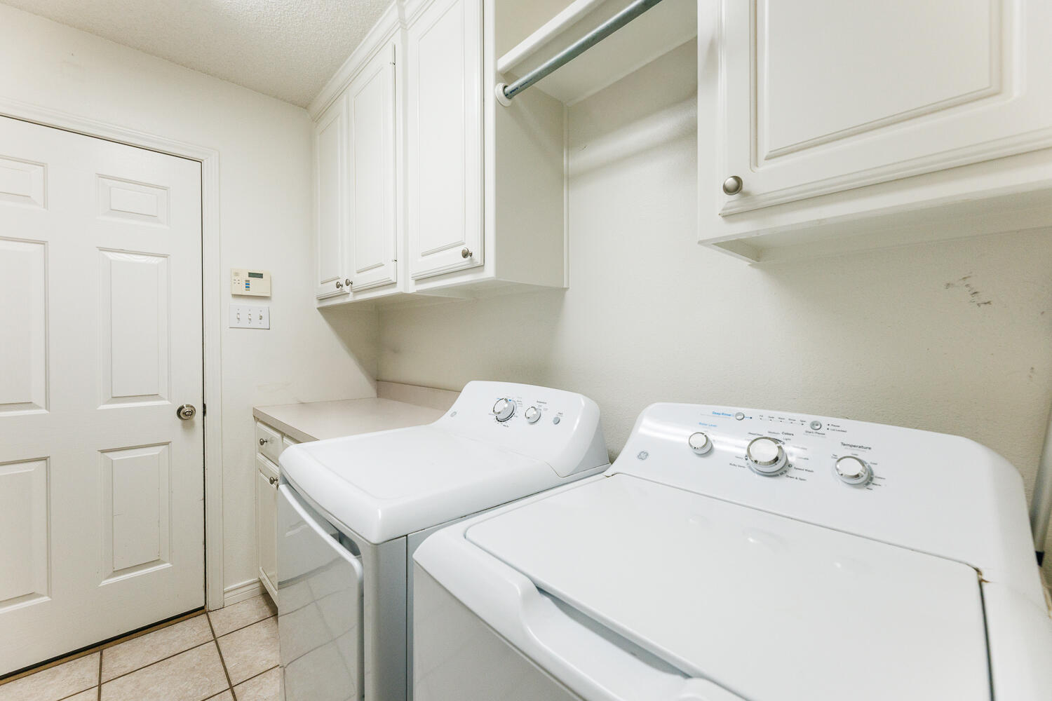 5504 101st Street Lubbock, TX 79424 - Photo 42 of 50 a utility room with dryer and washer