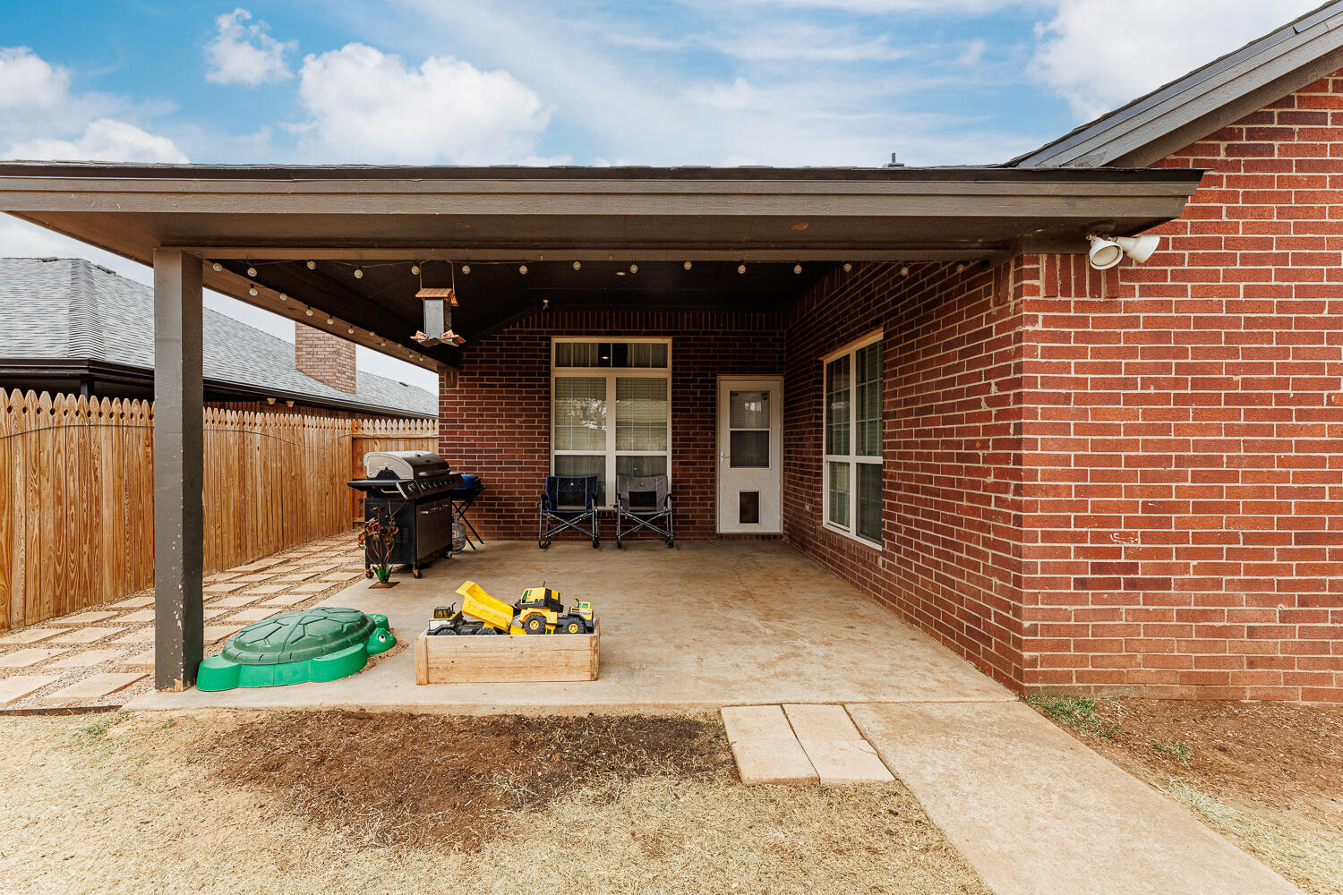 5504 101st Street Lubbock, TX 79424 - Photo 46 of 50 a view of yard with patio