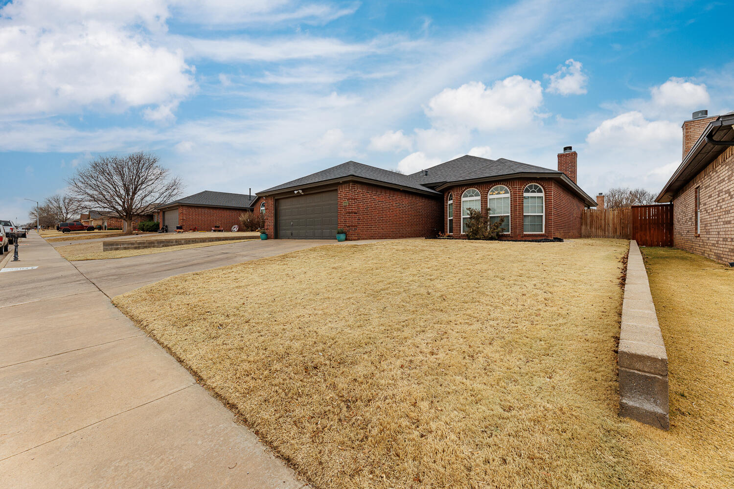 5504 101st Street Lubbock, TX 79424 - Photo 50 of 50 a front view of a house with a yard