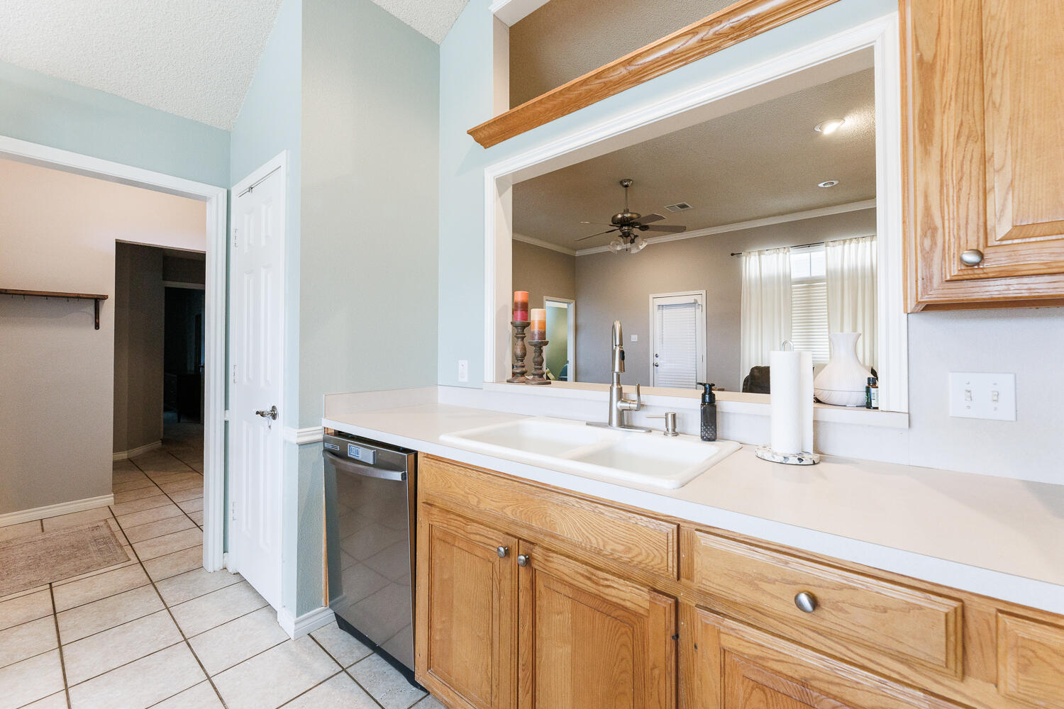 5504 101st Street Lubbock, TX 79424 - Photo 7 of 50 a bathroom with a sink and a mirror