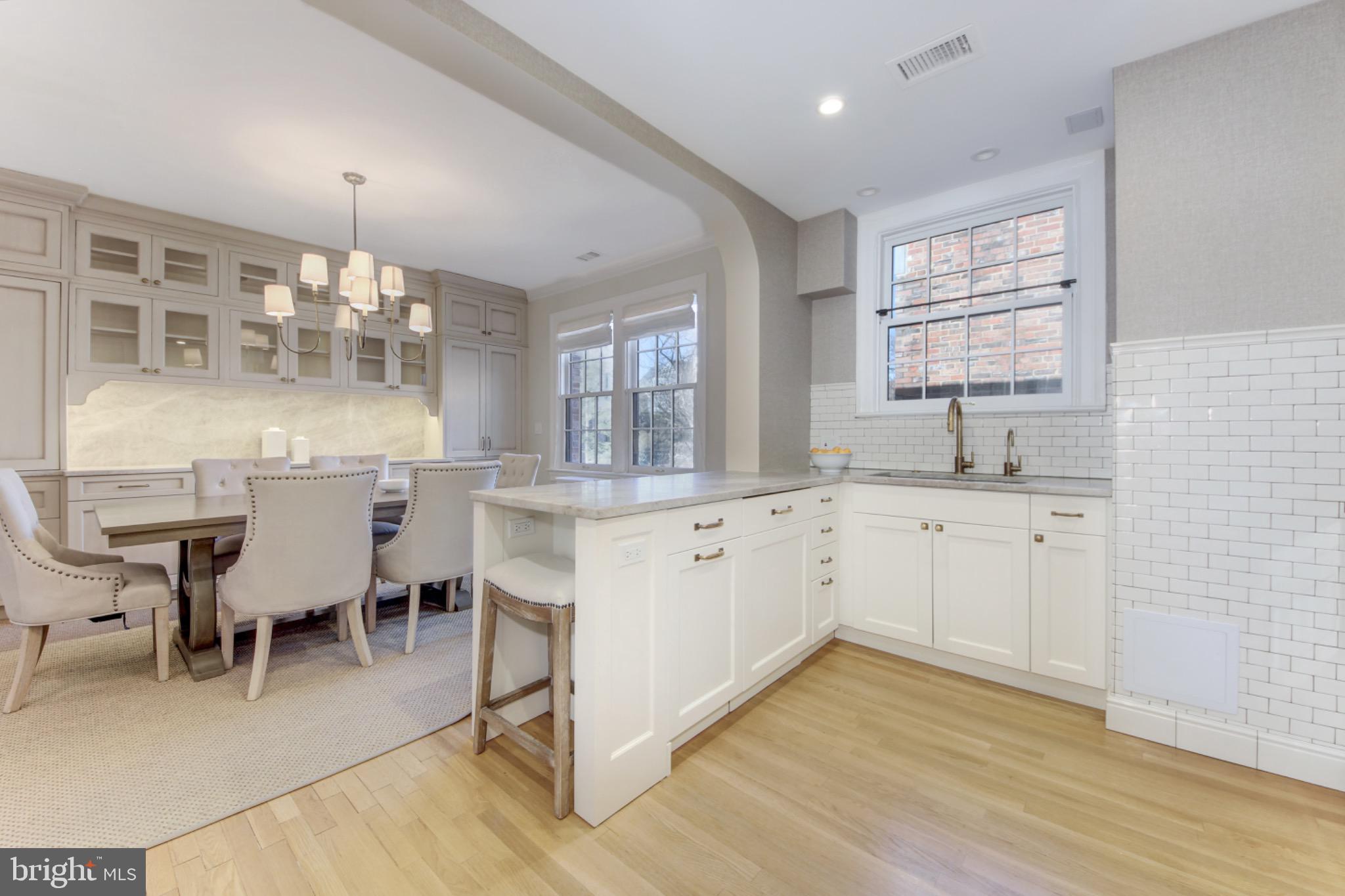3000 Tilden Street Northwest, Unit 501I Washington, DC 20008 - Photo 13 of 48 a kitchen with white cabinets and sink